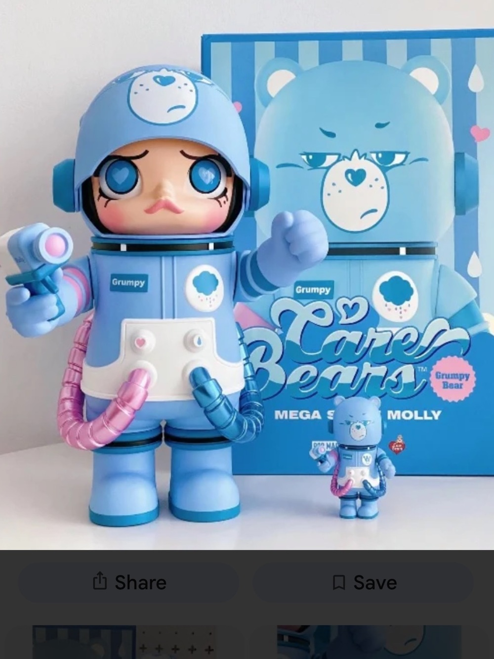 400% and 100% Care Bears Grumpy Bear Mega Molly Figures. Open box.